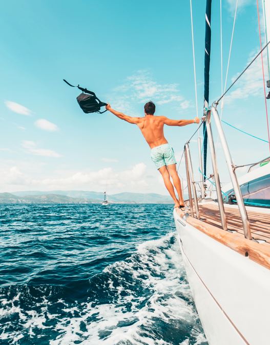 Tulum yachts; guy with a backpack on his hand